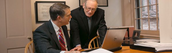 lawyers at a laptop