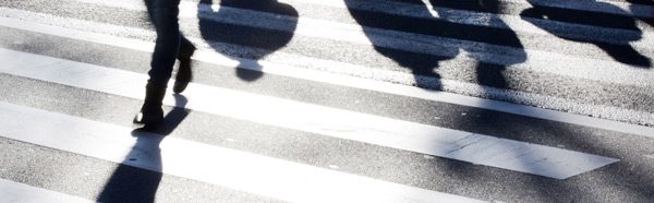 pedestrian shadows on a crosswalk