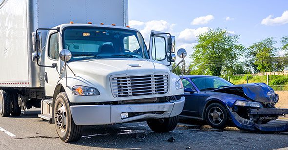 Collision of a semi truck with box trailer a passenger car on the highway road, as a result of which both cars were damaged, await the arrival of the police to draw up an accident report