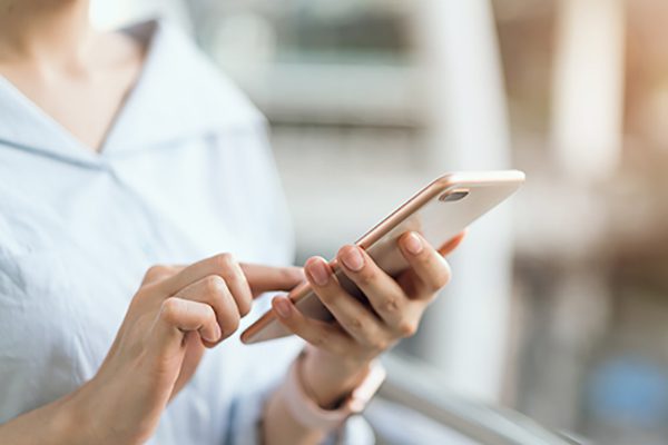 A person dials their phone to call a truck accident lawyer