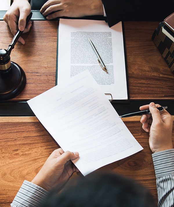 Client is bringing the documents to clarify the law to the lawyer at the prosecutor office.